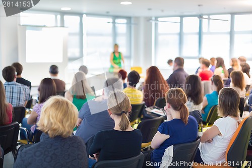 Image of Speaker at Business convention and Presentation.