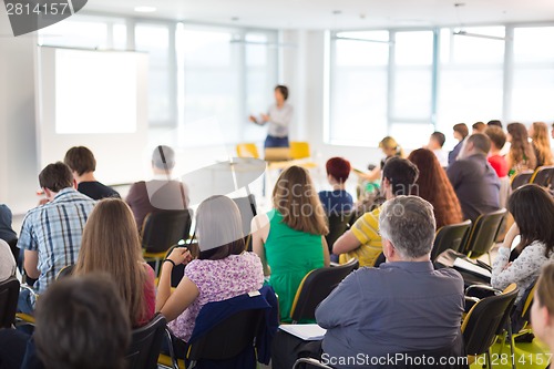 Image of Speaker at Business convention and Presentation.