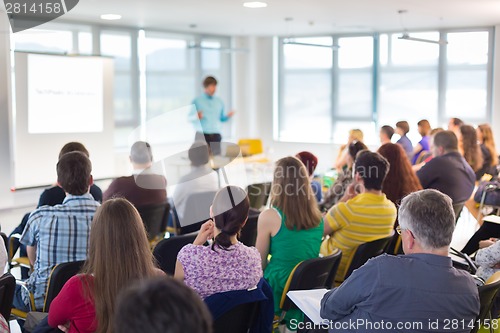 Image of Speaker at Business convention and Presentation.