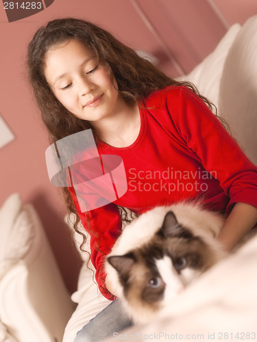 Image of young girl with her cat