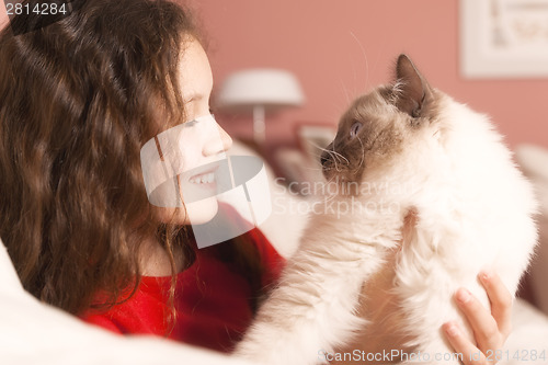 Image of young girl with her cat
