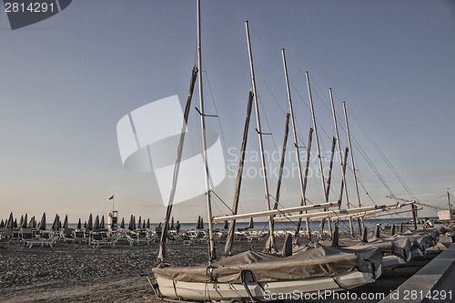 Image of bathhouse and sailing boats on the seaside