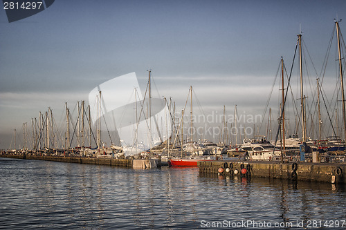 Image of Sailing and engine boats in the harbour channel