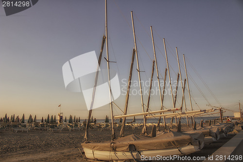 Image of bathhouse and sailing boats on the seaside