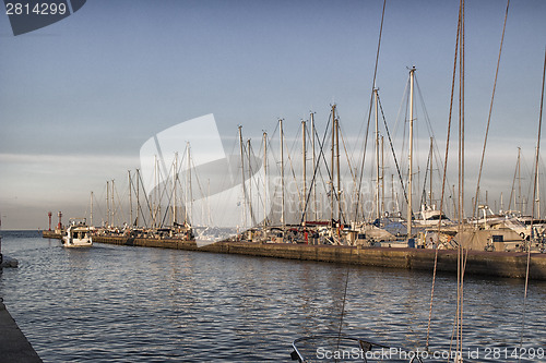 Image of Sailing and engine boats in the harbour channel