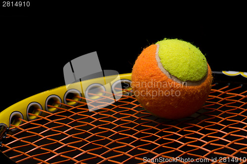 Image of Tennis ball for kids with tennis racket