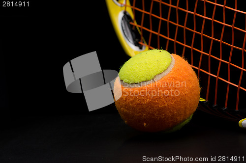 Image of Tennis ball for kids with tennis racket