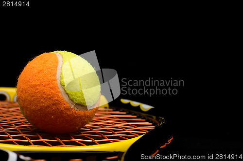 Image of Tennis ball for kids with tennis racket