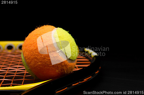 Image of Tennis ball for kids with tennis racket