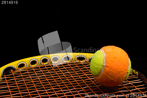 Image of Tennis ball for kids with tennis racket