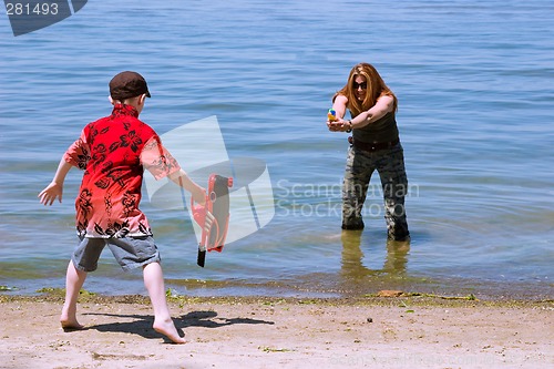 Image of Mother and Son playing at the beach