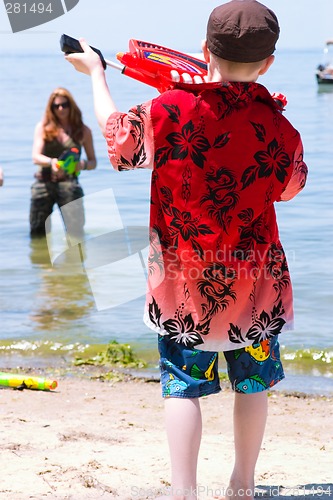 Image of Mother and Son playing at the beach