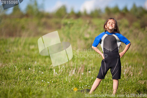 Image of Portrait of little girl in wetsuit