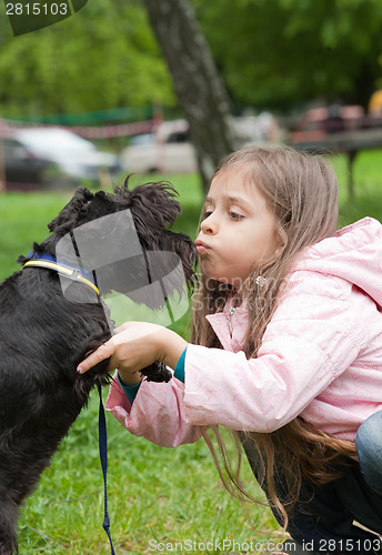 Image of Little girl and her dog