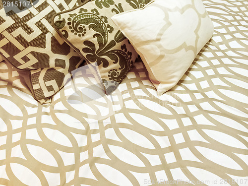 Image of Decorative cushions on a bed