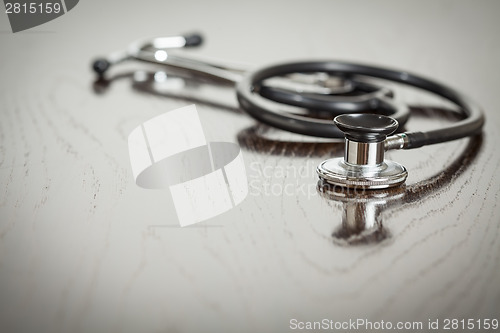 Image of Doctor Stethoscope Laying on a Reflective Table