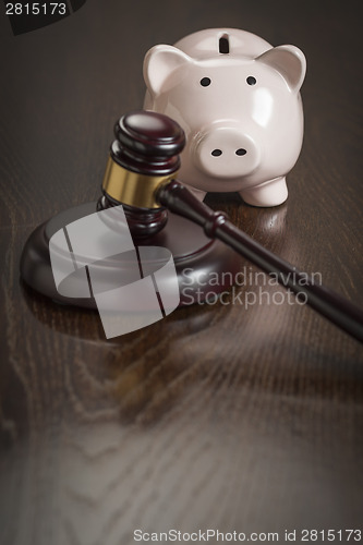 Image of Gavel and Piggy Bank on Table