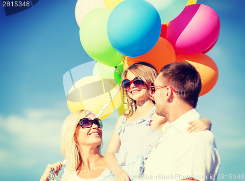 Image of family with colorful balloons