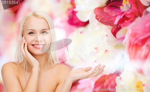 Image of smiling woman holding imaginary lotion jar