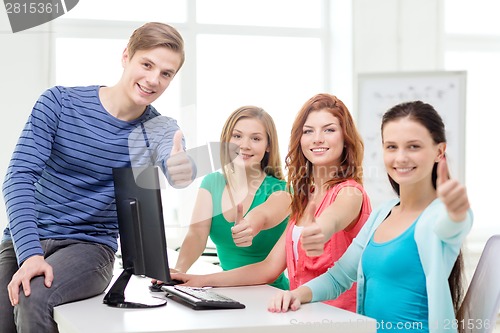Image of group of smiling students showing thumbs up