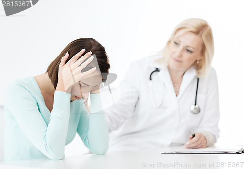 Image of doctor with patient in hospital