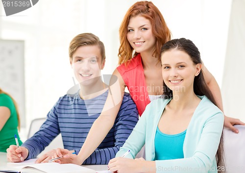 Image of students with textbooks and books at school