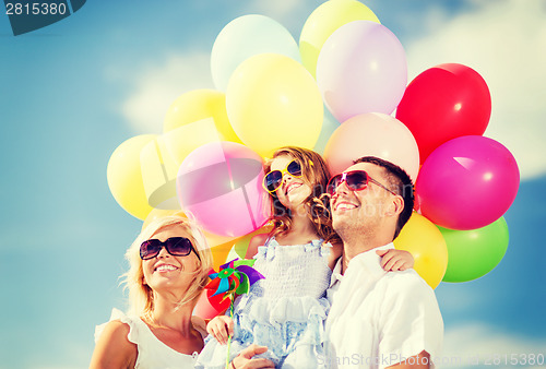 Image of family with colorful balloons