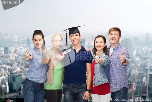 Image of group of students with diploma showing thumbs up