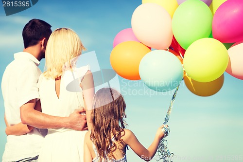 Image of family with colorful balloons