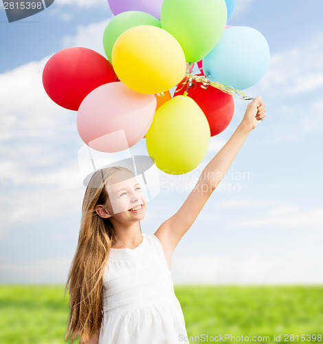 Image of happy girl with colorful balloons