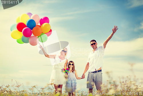 Image of family with colorful balloons