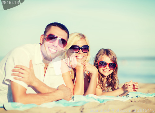 Image of happy family on the beach
