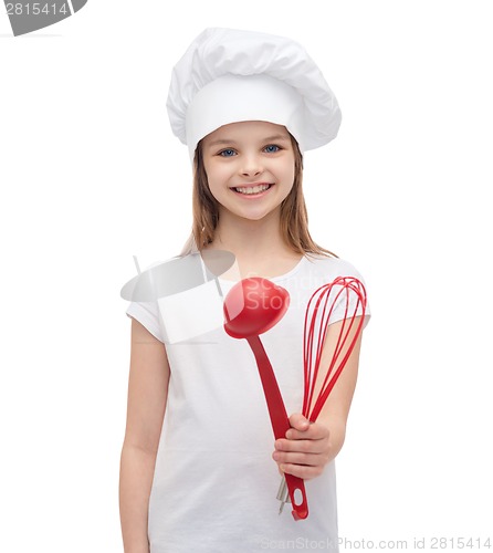 Image of smiling girl in cook hat with ladle and whisk