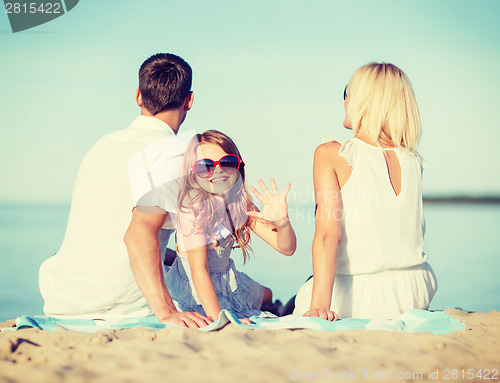 Image of happy family on the beach