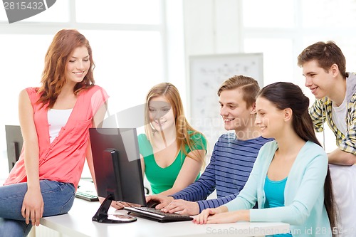 Image of group of smiling students having discussion