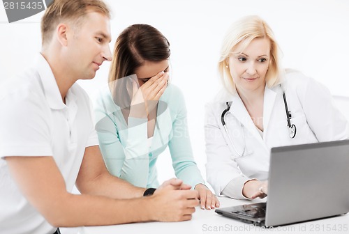 Image of doctor with patients in hospital