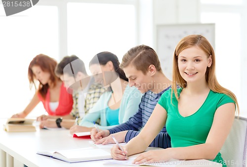 Image of students with textbooks and books at school