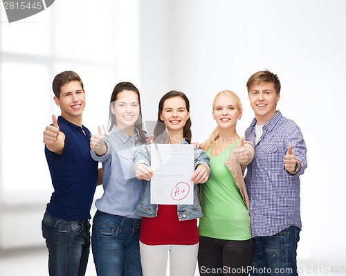 Image of group of students showing test and thumbs up