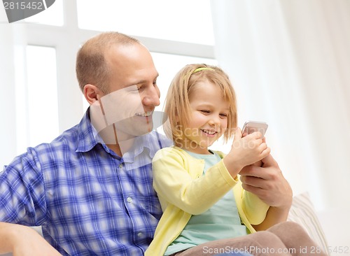 Image of happy father and daughter with smartphone