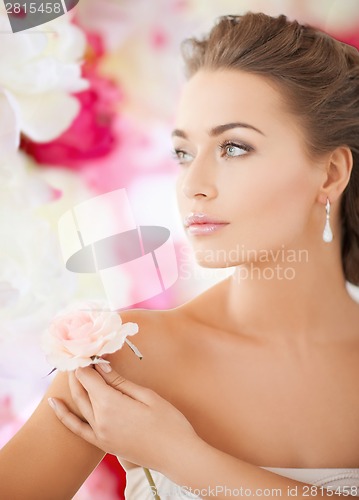 Image of young woman with rose flower