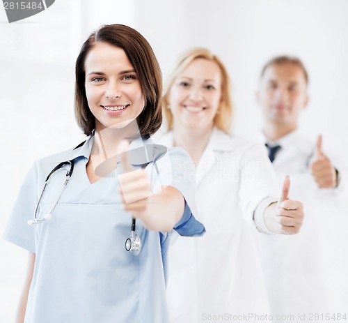 Image of team of doctors showing thumbs up