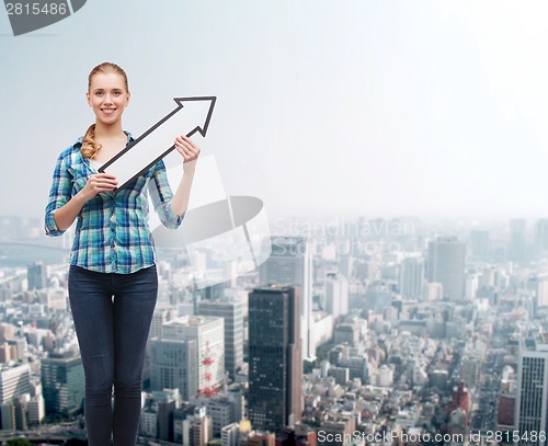 Image of smiling young woman with arrow poiting up