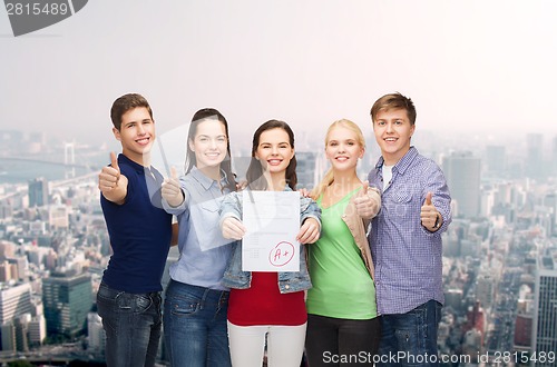 Image of group of students showing test and thumbs up