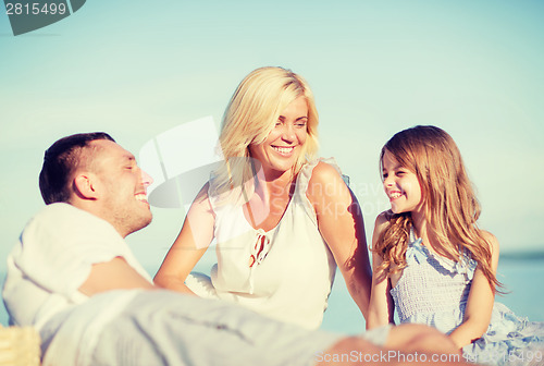 Image of happy family having a picnic