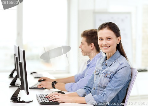 Image of two smiling students in computer class