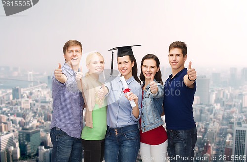 Image of group of students with diploma showing thumbs up