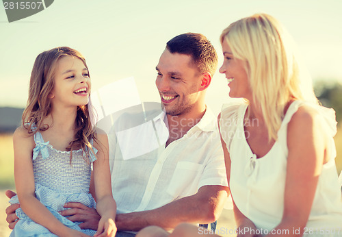 Image of happy family having a picnic