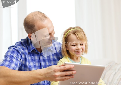 Image of happy father and daughter with tablet pc computer