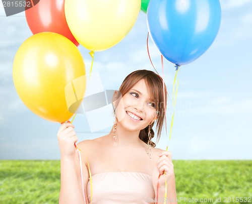 Image of happy teenage girl with balloons