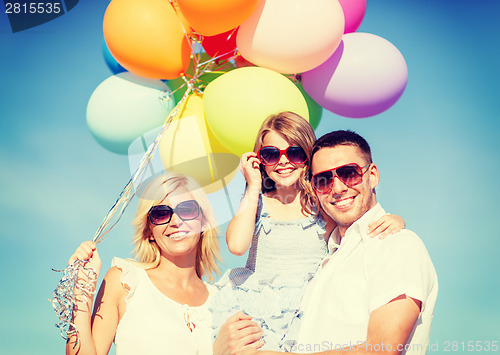 Image of family with colorful balloons